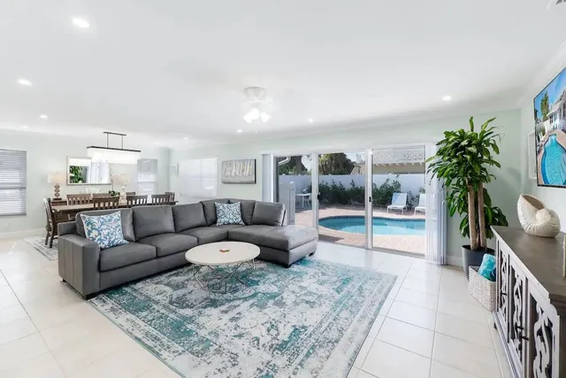 a view of a dining room with furniture and chandelier