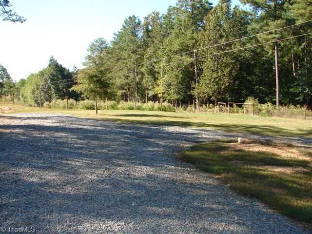 4682 Busbee Road Seagrove, NC 27341 - Photo 14 of 16 Exterior Back. View of land