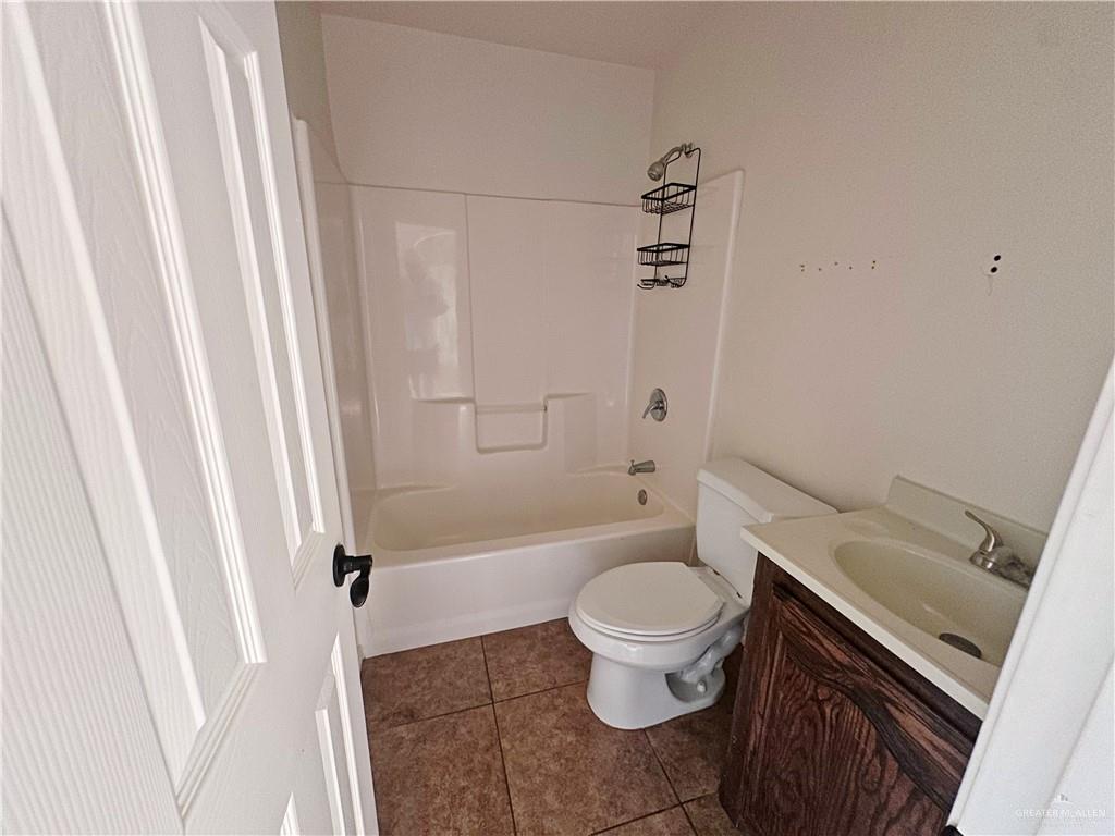 311 Teodora Drive Rio Grande City, TX 78582 - Photo 9 of 15 Bathroom with vanity, tile patterned flooring, and shower / bathtub combination