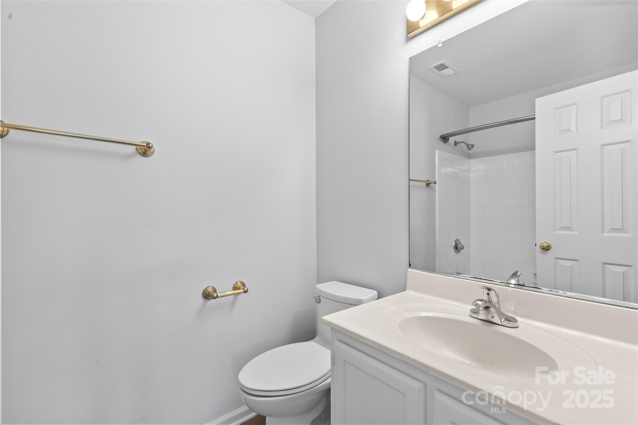 10942 Winterbourne Court Charlotte, NC 28277 - Photo 14 of 27 a bathroom with a sink toilet and shower