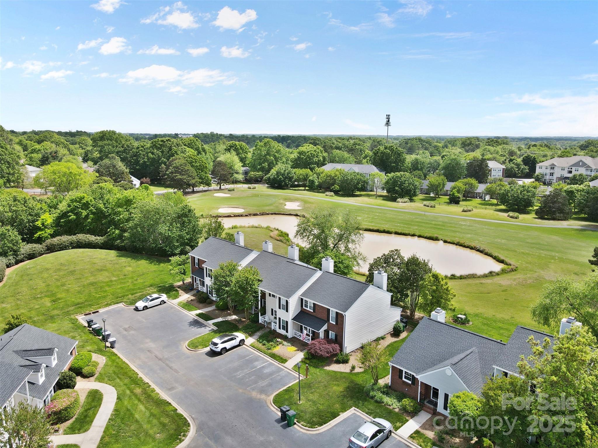 10942 Winterbourne Court Charlotte, NC 28277 - Photo 22 of 27 an aerial view of a house with garden space and outdoor seating