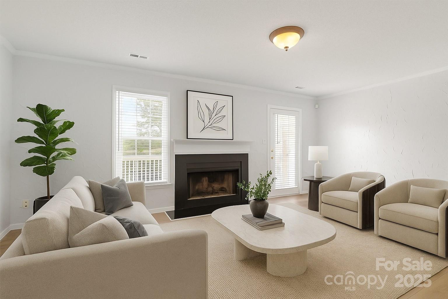 10942 Winterbourne Court Charlotte, NC 28277 - Photo 8 of 27 a living room with furniture and a fireplace
