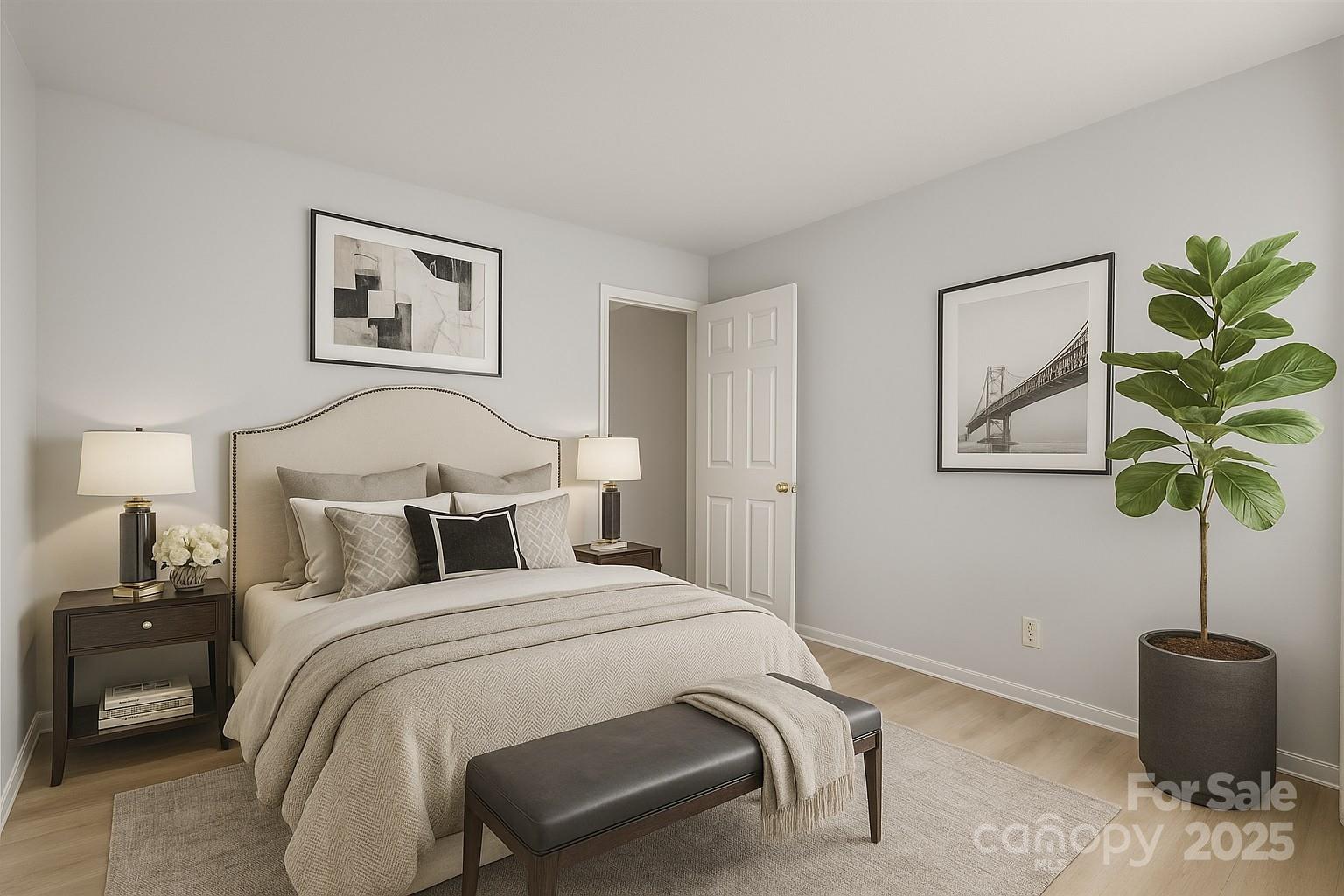 10942 Winterbourne Court Charlotte, NC 28277 - Photo 10 of 27 a bedroom with a bed and a potted plant