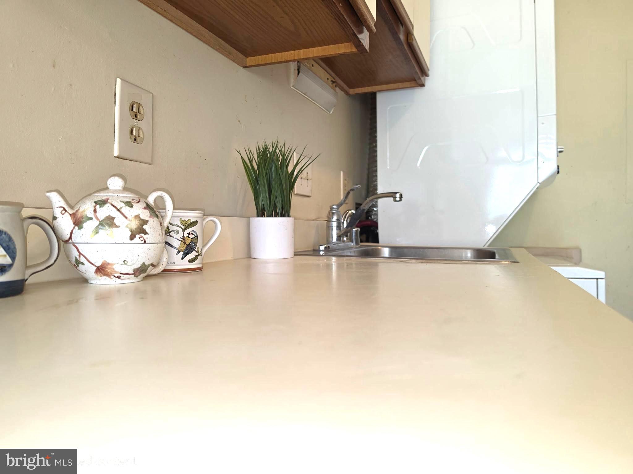 3384 Hewitt Avenue, Unit 201 Silver Spring, MD 20906 - Photo 6 of 10 a view of a room with a table and chair