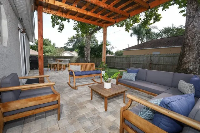 a outdoor living space with patio furniture and a potted plant