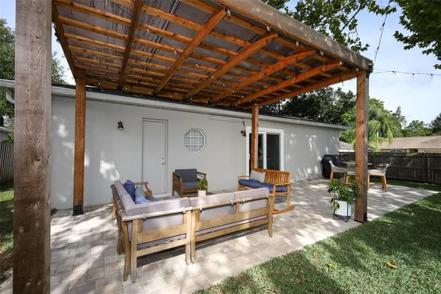 a view of a backyard with sitting area