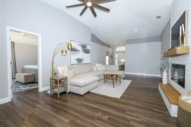 a living room with furniture and a fireplace