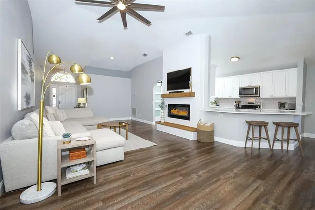 a living room with furniture and a fireplace