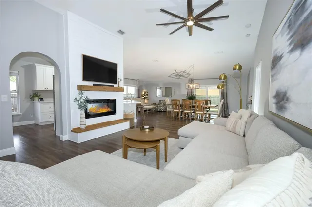 a living room with furniture and a fireplace