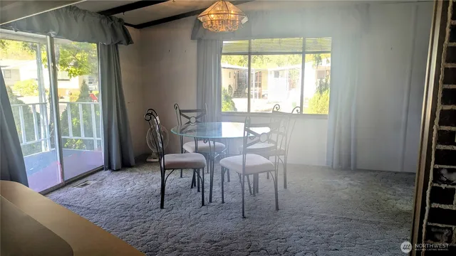 a view of a livingroom with furniture and window