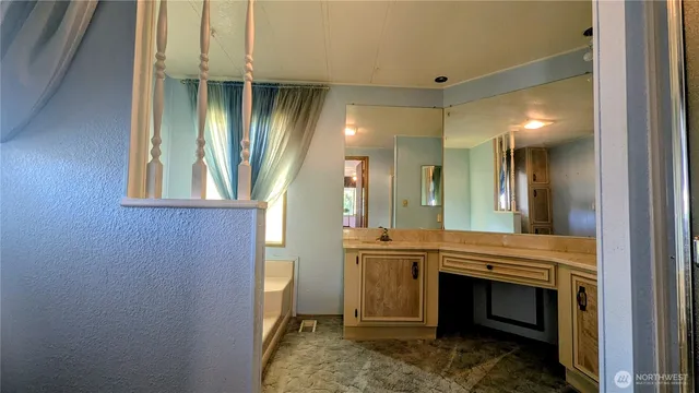 a view of a hallway with washer and dryer
