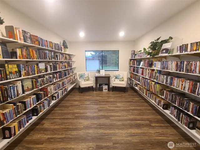 a living room with lots of books