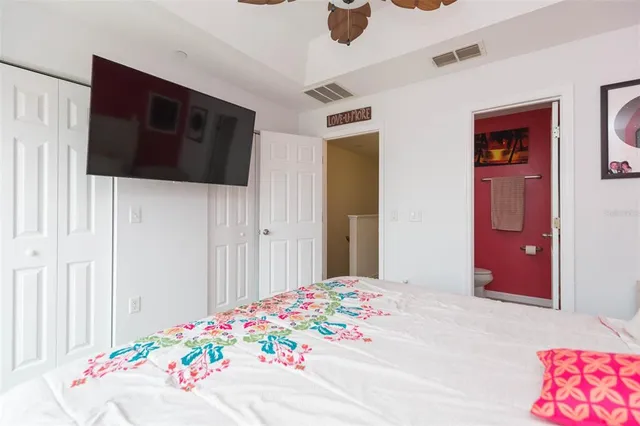 a bedroom with a bed and a dresser