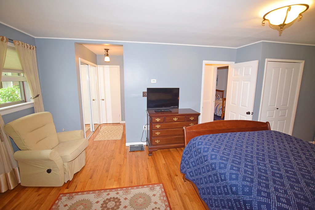 34 Hardwick Road Petersham, MA 01366 - Photo 14 of 24 a bedroom with a bed and wooden floor