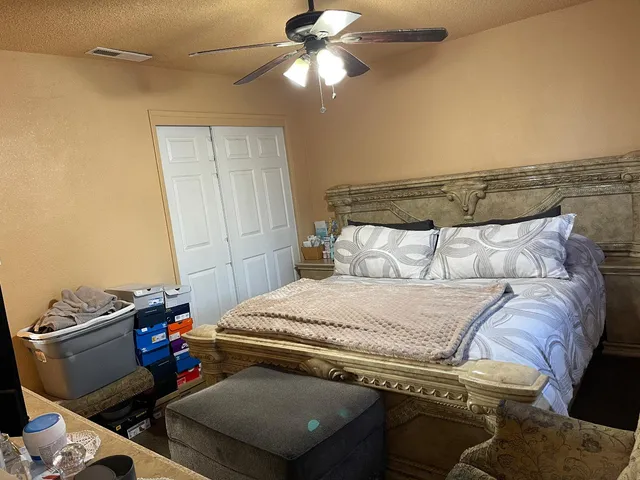 a bathroom with a sink vanity and toilet