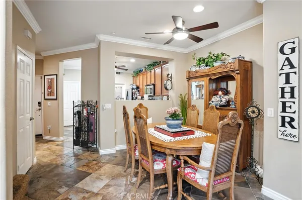 a view of a dining room with furniture and a fireplace