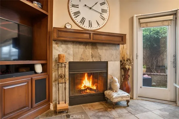 a living room with furniture ceiling fan and a window