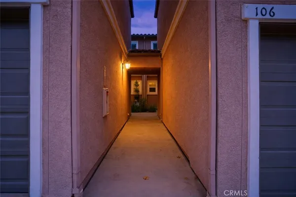 a view of a hallway with stairs