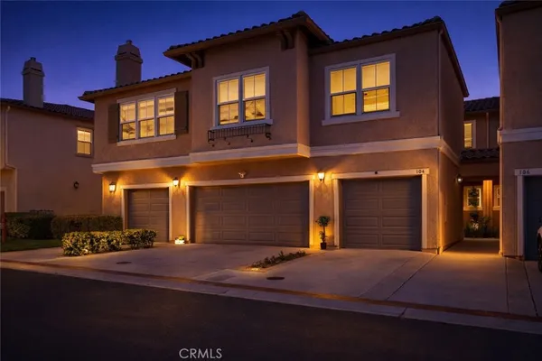 a front view of a house with a garage