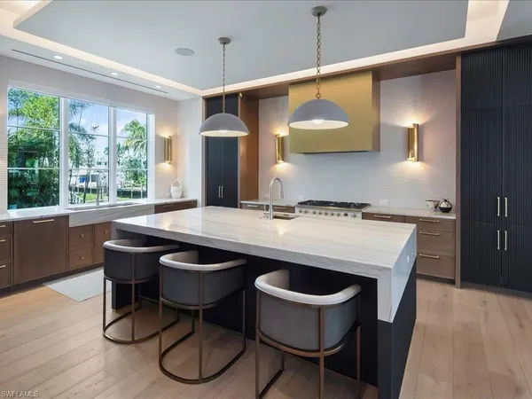 a kitchen with a table and chairs in it