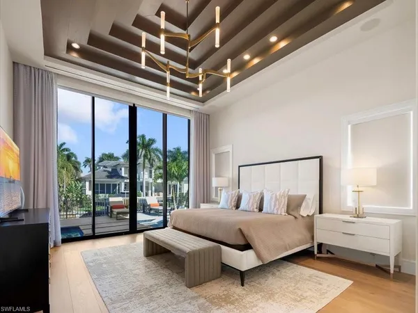 a spacious bedroom with a bed and a couch