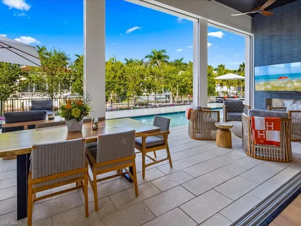 a outdoor living space with patio furniture and potted plants