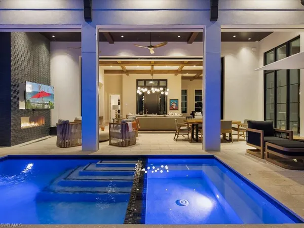 a living room with furniture and flat screen tv