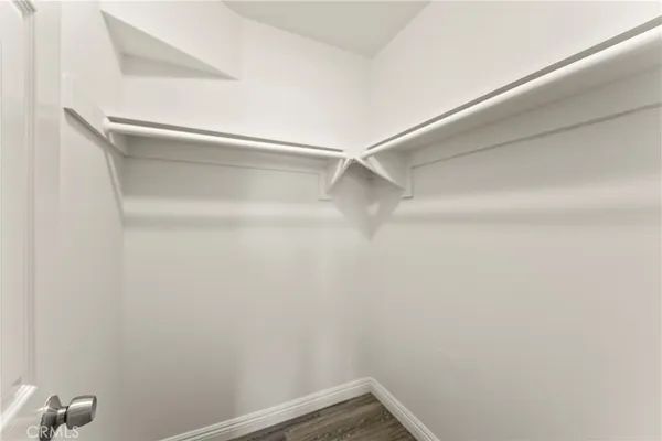 a spacious bathroom with a granite countertop sink and a mirror
