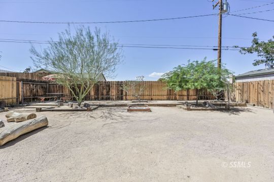 1233 Mayo Street Ridgecrest, CA 93555 - Photo 32 of 32 a view of a street with a house