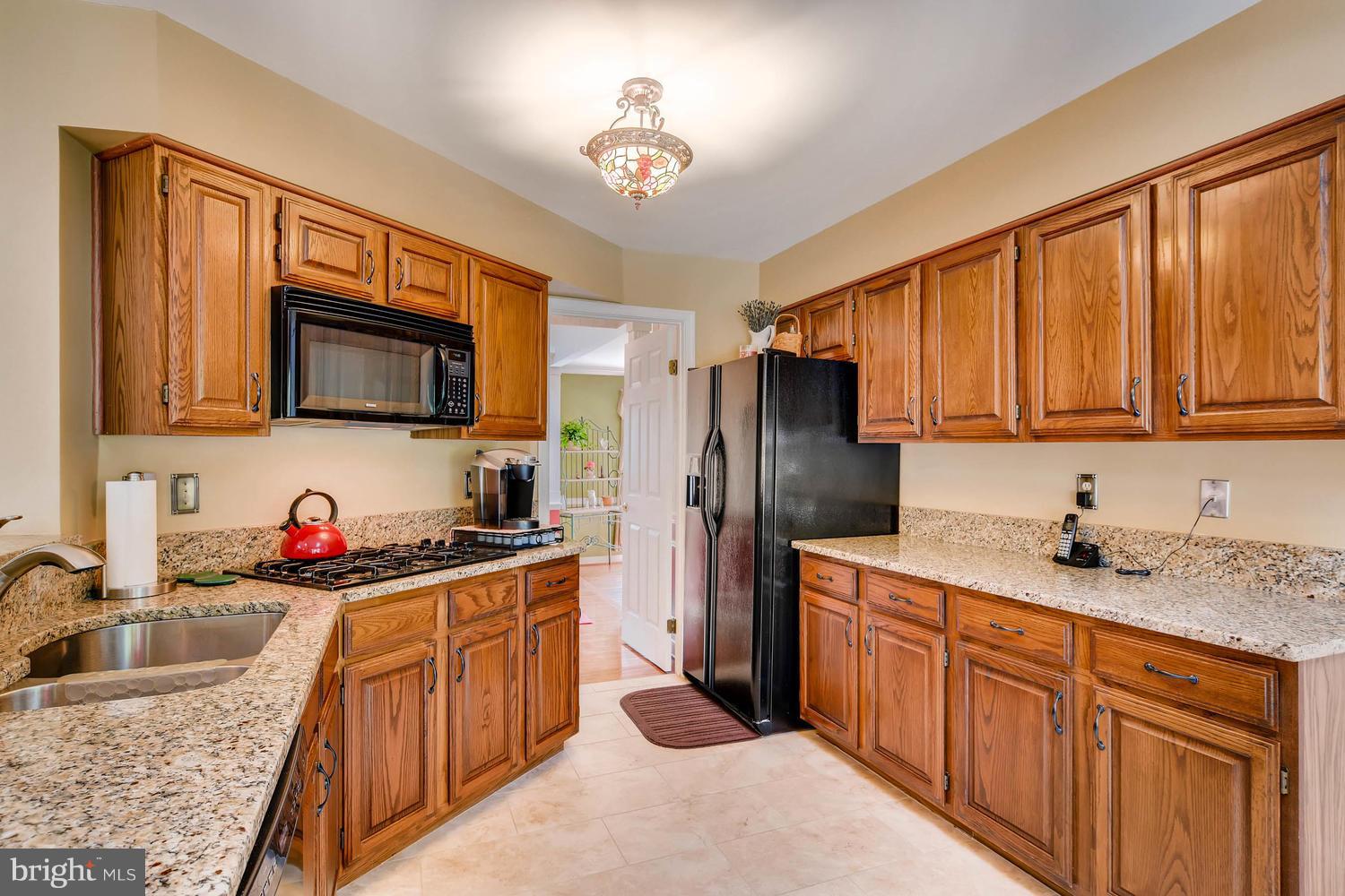 9001 Gardenia Road Baltimore, MD 21236 - Photo 29 of 30 Open Floor plan Kitchen with Granite Counters