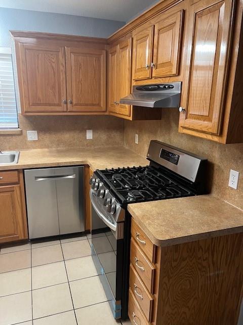 311 East 9th Street Ferris, TX 75125 - Photo 5 of 10 a kitchen with granite countertop a stove sink and cabinets