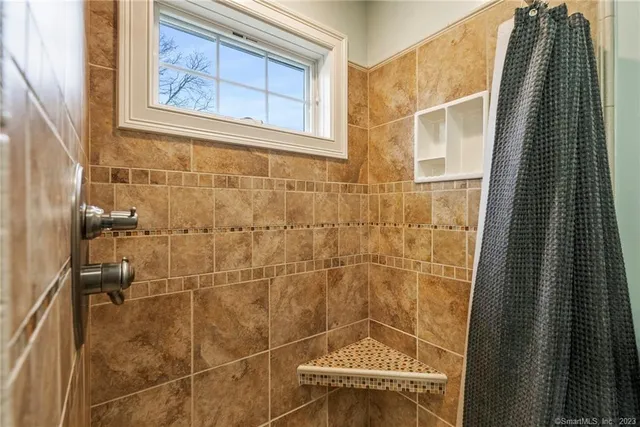 a view of a livingroom with furniture and a fireplace