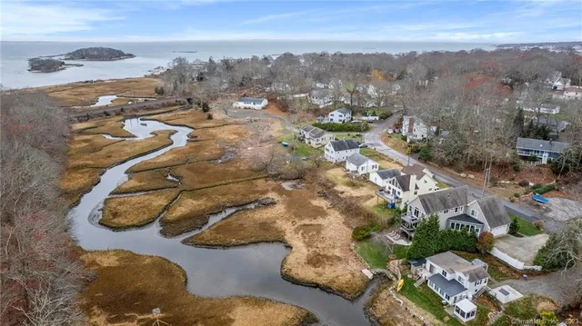 a view of a lake with furniture