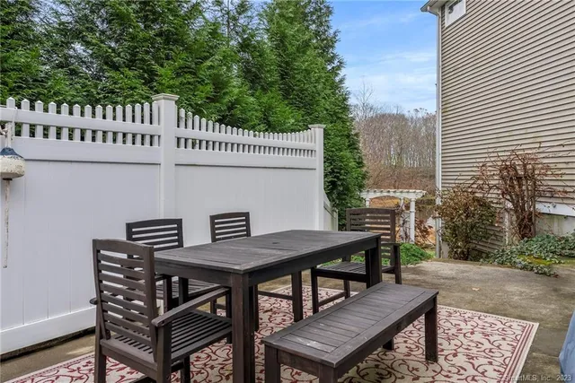 a house with lots of trees in the background