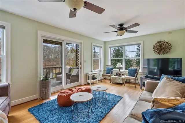 a room with stainless steel appliances kitchen island granite countertop furniture and a view of kitchen