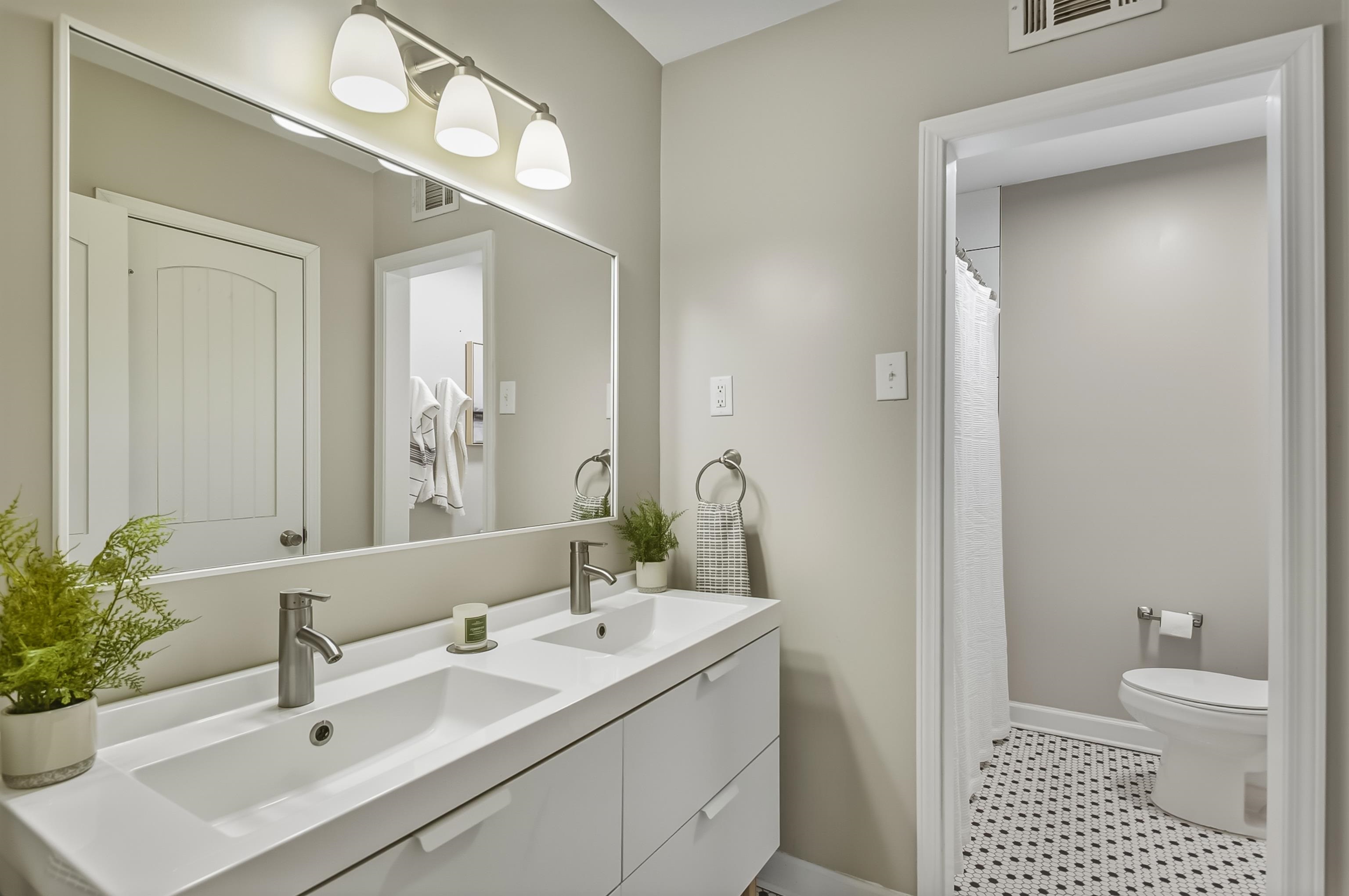 5155 Shady Grove Road Memphis, TN 38117 - Photo 30 of 40 Bathroom with double vanity and a shower with shower curtain