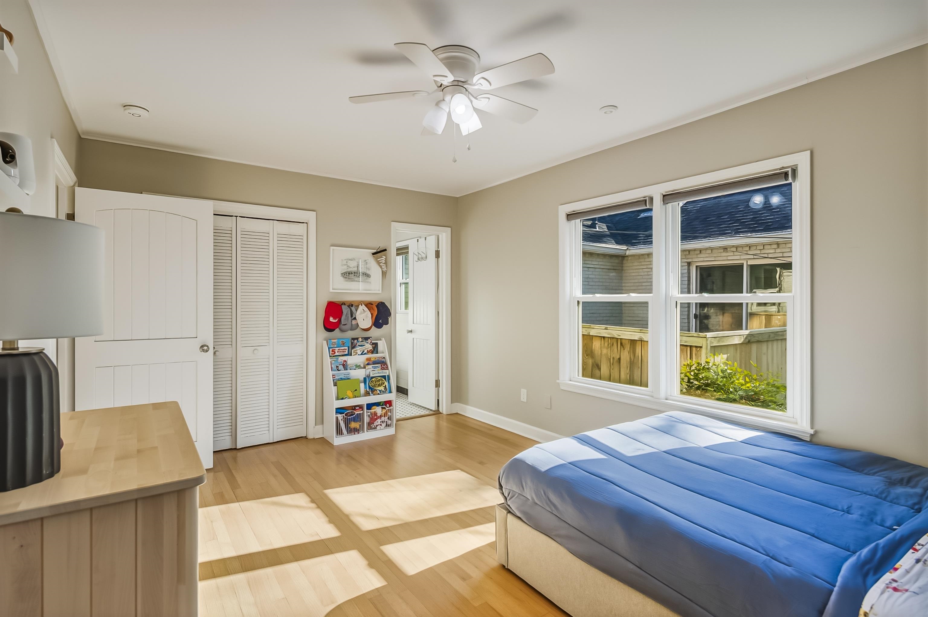 5155 Shady Grove Road Memphis, TN 38117 - Photo 33 of 40 Bedroom featuring light wood finished floors, ceiling fan, and a closet