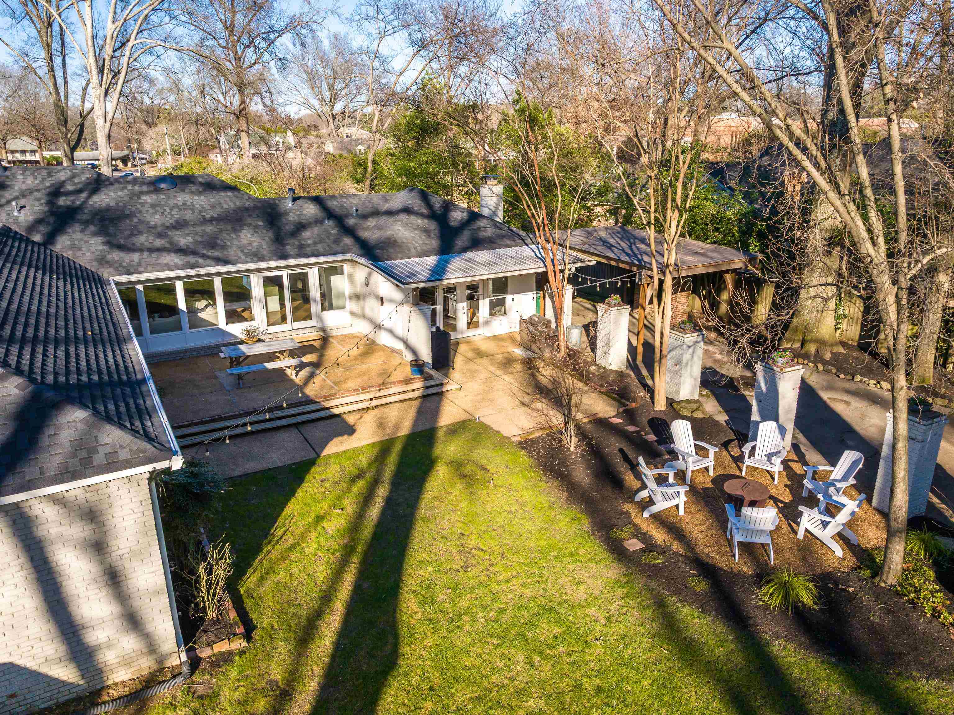 5155 Shady Grove Road Memphis, TN 38117 - Photo 39 of 40 Back of house with a patio area, a fire pit, and a yard