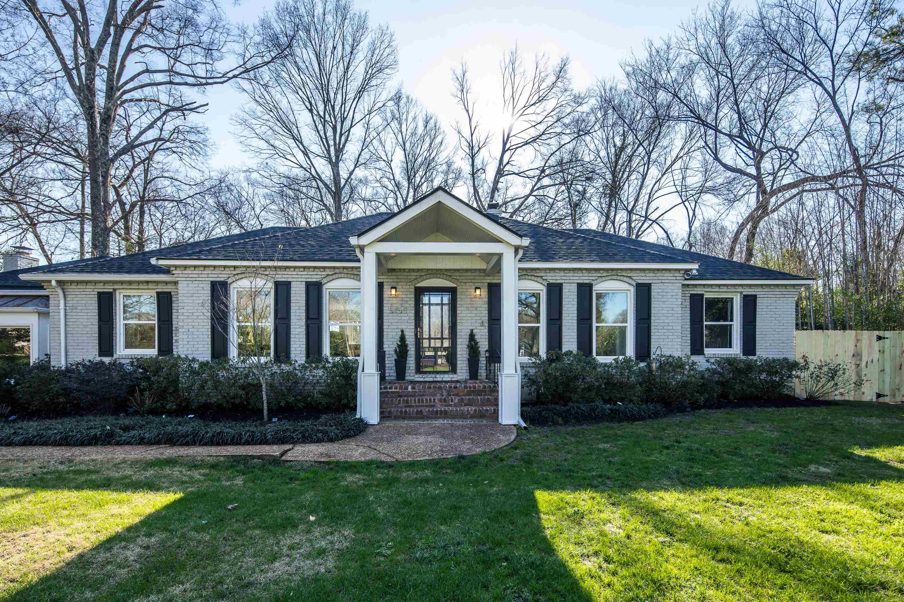 5155 Shady Grove Road Memphis, TN 38117 - Photo 4 of 40 Ranch-style home with a porch, brick siding, and a shingled roof