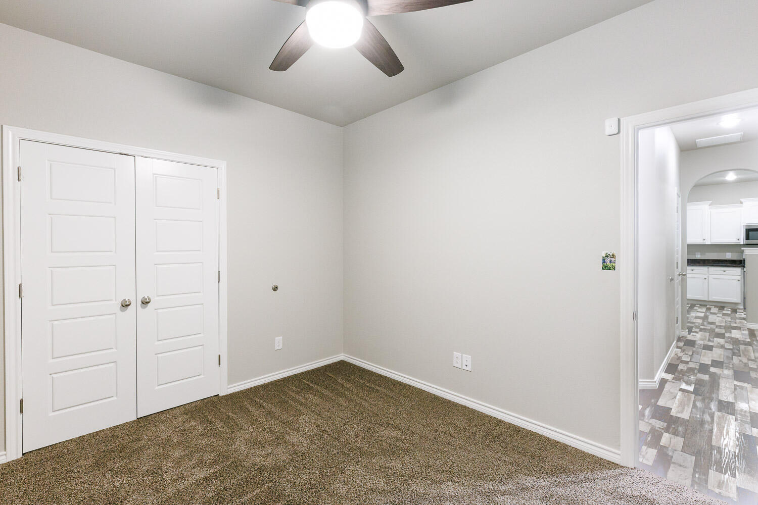 6956 12th Street Lubbock, TX 79416 - Photo 27 of 43 a view of an empty room and chandelier fan