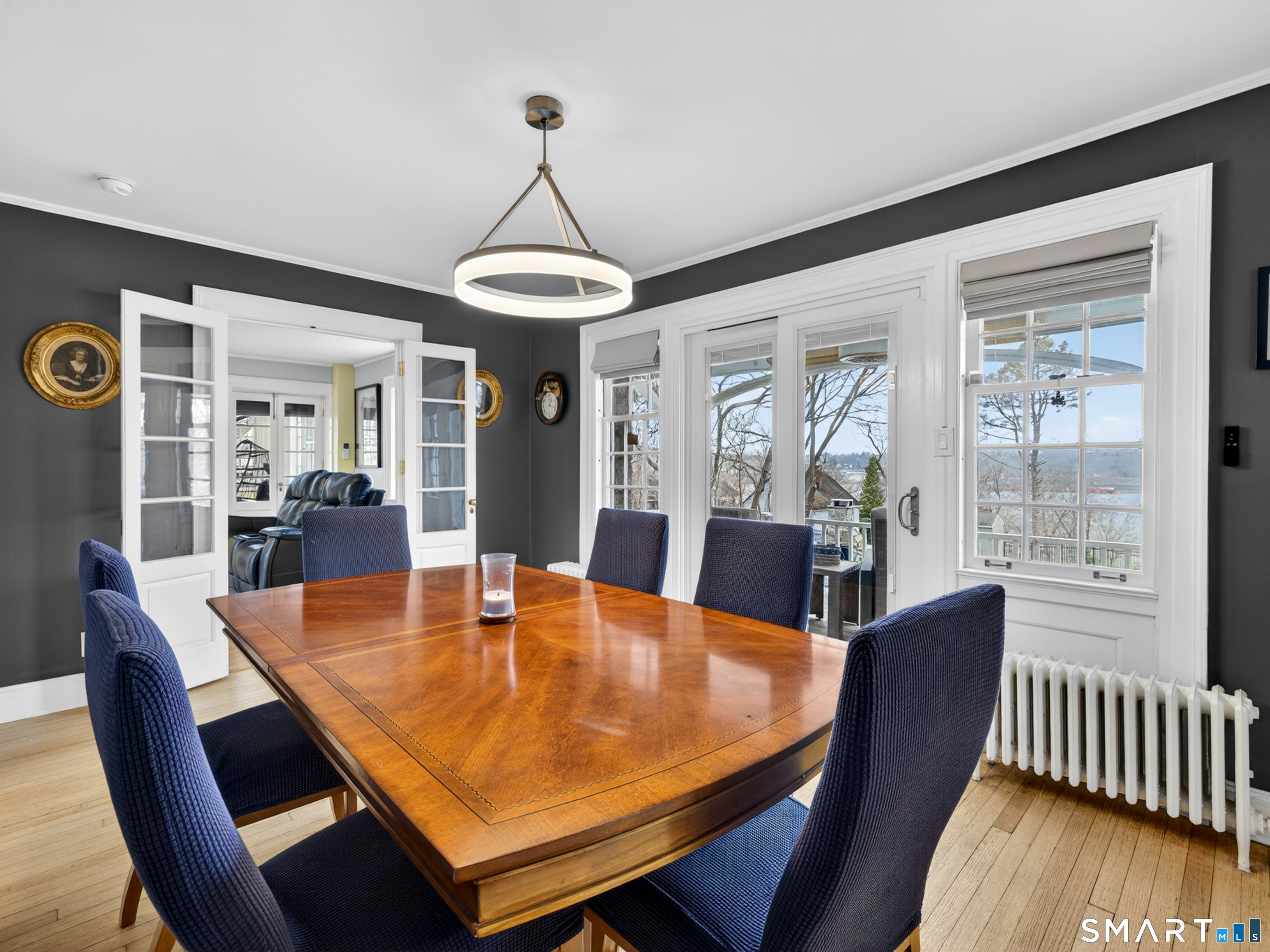 76 Starr Hill Road Groton, CT 06340 - Photo 9 of 40 a dining room with furniture a chandelier and wooden floor