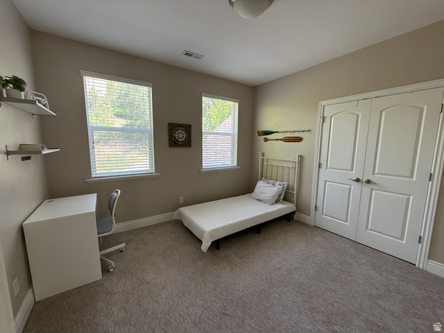 2388 East 850 South Springville, UT 84663 - Photo 36 of 58 Soft neutral carpeting, dual windows with blinds, and white bi-fold closet doors
