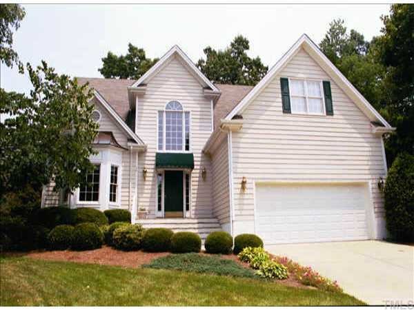 8720 Aldersgate Way Raleigh, NC 27615 - Photo 1 of 1 a front view of a house with a yard and garage