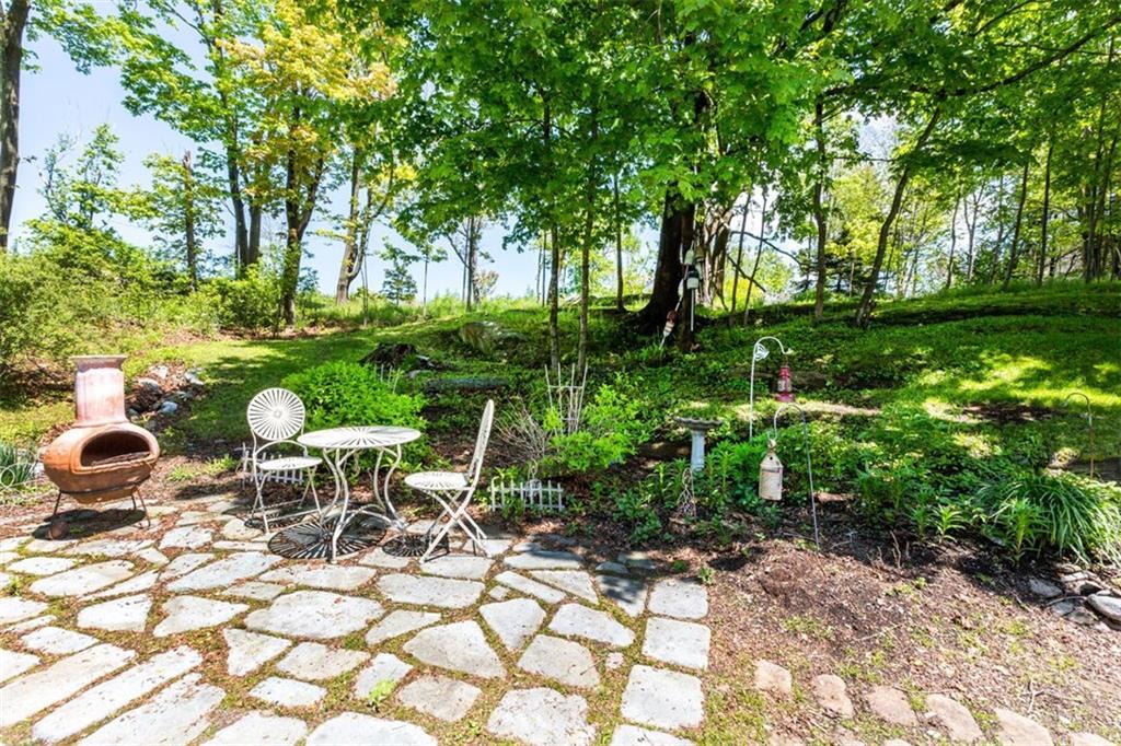 81 Lowells Cove Road Orrs Island, ME 04066 - Photo 2 of 28 Stone patio with views of Lowell Cove.