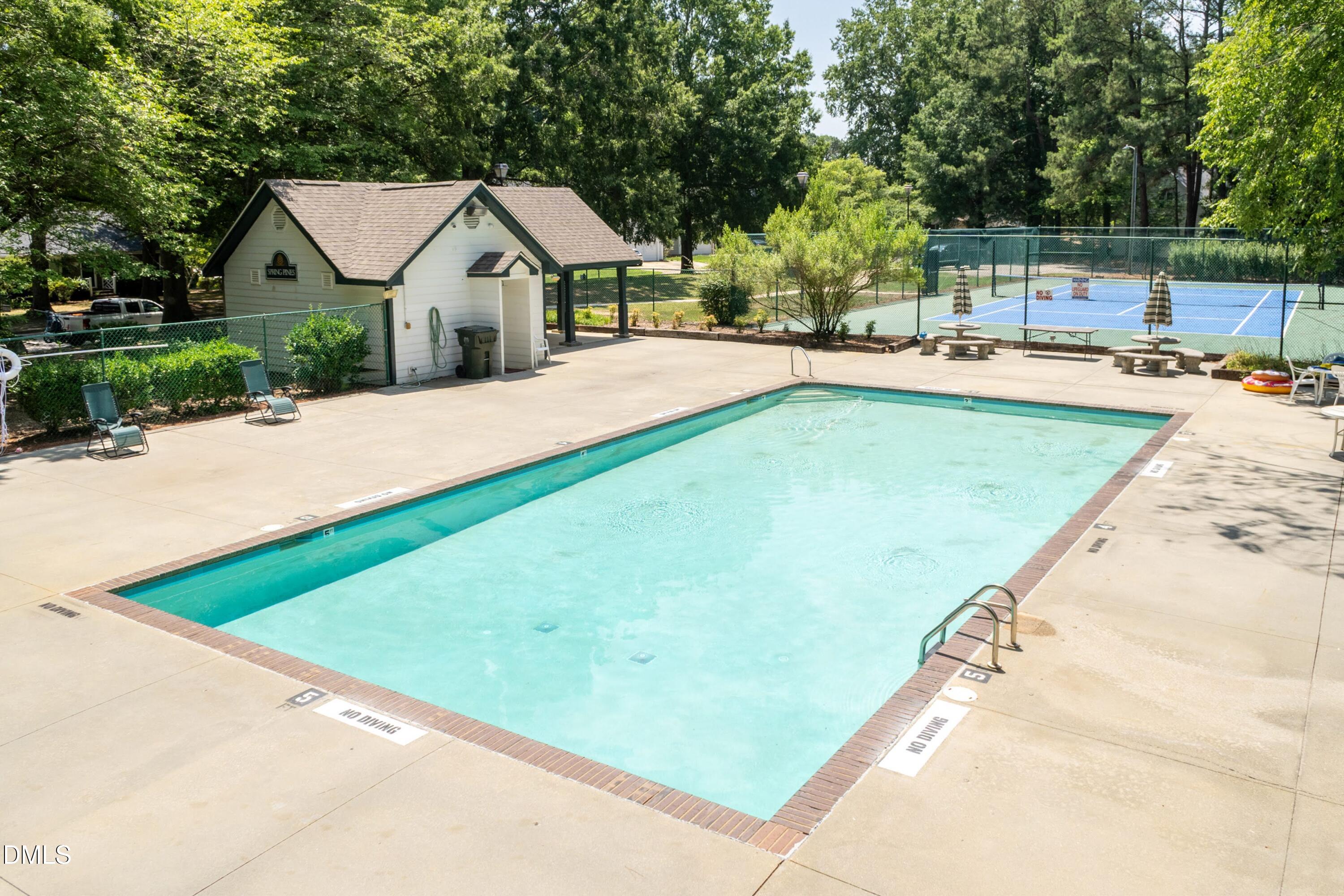 5604 Spring Pines Way Raleigh, NC 27616 - Photo 21 of 22 a swimming pool with outdoor seating and yard