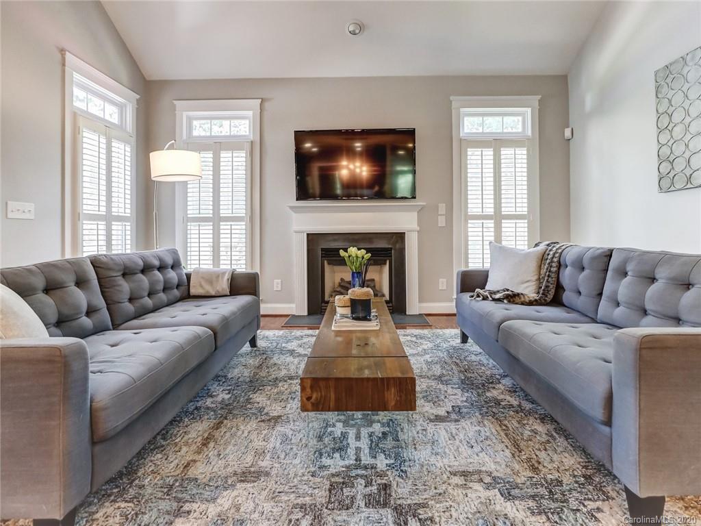 3384 Richard's Crossing Fort Mill, SC 29708 - Photo 23 of 48 a living room with furniture a fireplace and a flat screen tv