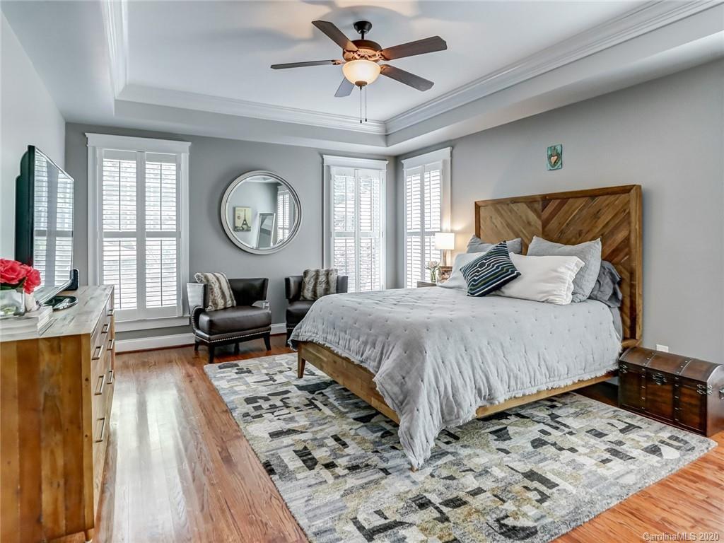 3384 Richard's Crossing Fort Mill, SC 29708 - Photo 27 of 48 a bedroom with a bed and a chandelier