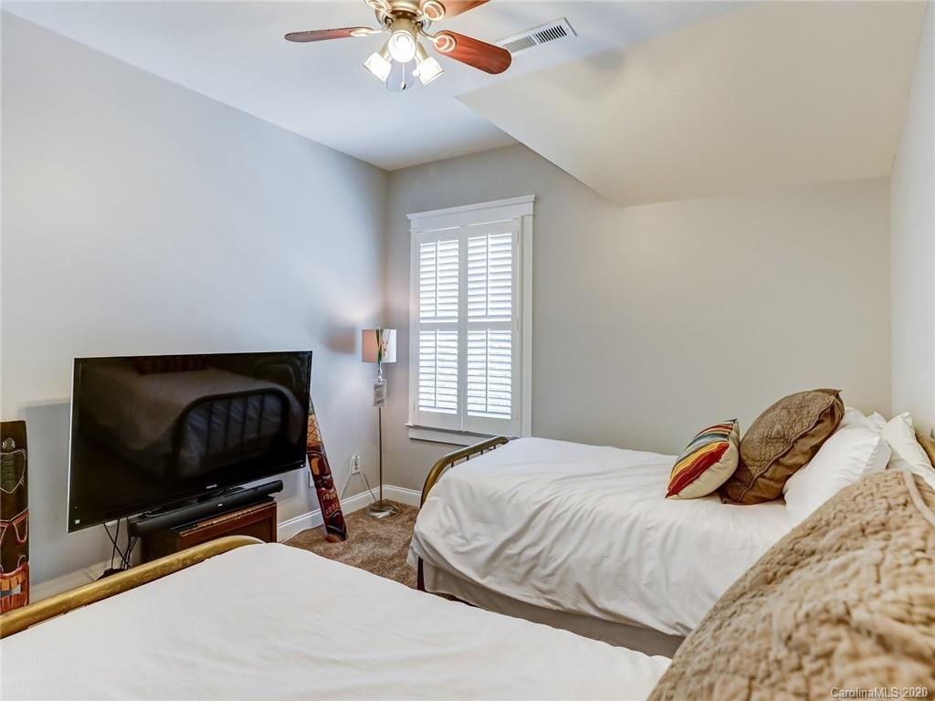 3384 Richard's Crossing Fort Mill, SC 29708 - Photo 36 of 48 a bedroom with two beds and a flat screen tv