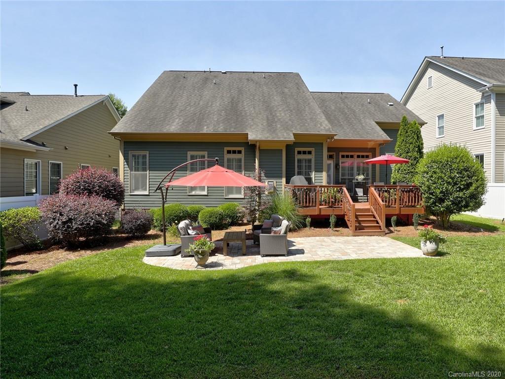 3384 Richard's Crossing Fort Mill, SC 29708 - Photo 46 of 48 a patio with a table and chairs under an umbrella