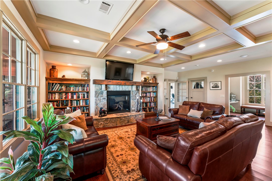110 Gabriel Way Pickens, SC 29671 - Photo 43 of 48 Community Center. A stone fireplace anchors this warm gathering space, featuring coffered ceilings and rich wood flooring.